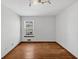 Clean and bright bedroom with hardwood floors and double windows at 980 Pine Grove Pointe Dr, Roswell, GA 30075