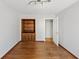 Bedroom with hardwood floors, built-in bookcase, and closet at 980 Pine Grove Pointe Dr, Roswell, GA 30075