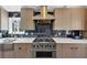 Stylish kitchen with stainless steel appliances, white countertops and dark backsplash tiles at 980 Pine Grove Pointe Dr, Roswell, GA 30075