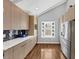 Bright kitchen featuring stainless steel appliances, wood floors and lots of storage at 980 Pine Grove Pointe Dr, Roswell, GA 30075
