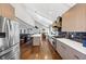 Open concept kitchen and living room featuring stainless appliances and ample counter space at 980 Pine Grove Pointe Dr, Roswell, GA 30075