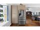 Open concept kitchen and living room featuring stainless appliances and leather sectional at 980 Pine Grove Pointe Dr, Roswell, GA 30075