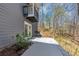 Concrete walkway to doors with nearby landscaping and trees at 980 Pine Grove Pointe Dr, Roswell, GA 30075