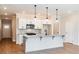 Modern kitchen showcasing a center island, pendant lighting, and stainless steel appliances at 105 Priestwood Ln, Acworth, GA 30102