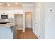 Gourmet kitchen with island seating, modern appliances, and white cabinetry at 105 Priestwood Ln, Acworth, GA 30102