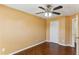 This bedroom offers gleaming hardwood floors and a modern ceiling fan at 1703 Mission Park Dr, Loganville, GA 30052