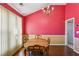 Charming dining room with a chandelier, hardwood floors, and large windows providing ample light at 1703 Mission Park Dr, Loganville, GA 30052
