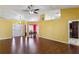 Inviting living room featuring hardwood floors, high ceilings, and open access to other living spaces at 1703 Mission Park Dr, Loganville, GA 30052