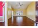 Spacious living room with abundant natural light, gleaming hardwood floors, and high ceilings at 1703 Mission Park Dr, Loganville, GA 30052