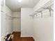 Walk-in closet with wood floors and wire shelving at 1703 Mission Park Dr, Loganville, GA 30052