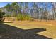 Large backyard offers plenty of space for outdoor activities and entertainment at 173 Northshore Xing, Dallas, GA 30157