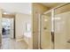 Bathroom featuring a glass shower with tile and white tile floors at 173 Northshore Xing, Dallas, GA 30157
