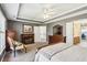 Primary bedroom featuring a fireplace, wooden dresser and decor at 173 Northshore Xing, Dallas, GA 30157