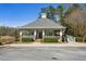 Community center exterior featuring porch, walkway, and landscaping at 173 Northshore Xing, Dallas, GA 30157
