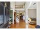 Grand foyer featuring gleaming hardwood floors, a soaring ceiling and an open staircase leading to the upper level at 173 Northshore Xing, Dallas, GA 30157