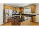 Well-equipped kitchen featuring an island, stainless steel appliances, and granite countertops for cooking and entertaining at 173 Northshore Xing, Dallas, GA 30157