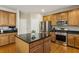 Well-equipped kitchen with stainless steel appliances, granite countertops, and a central island at 173 Northshore Xing, Dallas, GA 30157
