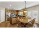 Eat-in kitchen with stainless steel appliances, granite countertops, and wood cabinets, providing both style and functionality at 173 Northshore Xing, Dallas, GA 30157