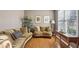 Cozy living room area filled with natural light, neutral-toned walls, hardwood floors, and comfortable seating at 173 Northshore Xing, Dallas, GA 30157