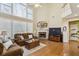 Inviting living room features a soaring ceiling, fireplace, and ample natural light at 173 Northshore Xing, Dallas, GA 30157