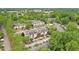 Aerial view of the apartments surrounded by lush trees, a pool, and tennis courts at 320 Park Ridge Cir, Marietta, GA 30068