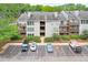 Exterior view of the apartment building with balconies, well-maintained landscaping, and parking at 320 Park Ridge Cir, Marietta, GA 30068