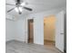 Bedroom featuring light gray floors, ceiling fan and closet at 320 Park Ridge Cir, Marietta, GA 30068