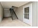 Exterior entrance featuring a metal staircase leading up to unit 120 at 320 Park Ridge Cir, Marietta, GA 30068