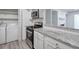 Updated kitchen boasts stainless steel appliances, stone countertops, and a washer/dryer at 320 Park Ridge Cir, Marietta, GA 30068