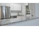 Updated kitchen features stainless steel appliances, sink and stone countertops at 320 Park Ridge Cir, Marietta, GA 30068