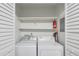Laundry closet with washer, dryer and overhead shelving at 320 Park Ridge Cir, Marietta, GA 30068
