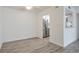 Bright living room with light gray flooring leads to stainless steel kitchen appliances at 320 Park Ridge Cir, Marietta, GA 30068