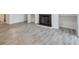 Living room showcasing wood-look floors, a fireplace, and built-in shelving at 320 Park Ridge Cir, Marietta, GA 30068
