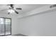 Bright living room with a ceiling fan and sliding glass doors leading to a balcony at 320 Park Ridge Cir, Marietta, GA 30068
