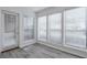 Bright room featuring three large windows and wood-look floors at 320 Park Ridge Cir, Marietta, GA 30068