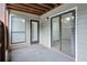 Covered patio area with wood fence, view of the trees, and sliding glass doors into unit at 320 Park Ridge Cir, Marietta, GA 30068