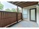 Outdoor patio featuring a stained wood fence and a view of the trees at 320 Park Ridge Cir, Marietta, GA 30068