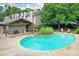 Community pool area featuring an inviting pool, chairs and a pool house at 320 Park Ridge Cir, Marietta, GA 30068