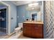 Nicely designed bathroom featuring a vanity with granite countertops and a shower with decorative curtain at 3324 Peachtree Ne Rd # 814, Atlanta, GA 30326