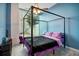 Stylish bedroom featuring a four-poster bed, ceiling fan, and balcony access with great views at 3324 Peachtree Ne Rd # 814, Atlanta, GA 30326