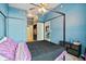 Cozy bedroom featuring a four-poster bed, ceiling fan, and access to the closet and bathroom at 3324 Peachtree Ne Rd # 814, Atlanta, GA 30326