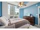 Bright and airy bedroom with ceiling fan and access to a balcony with outdoor seating area at 3324 Peachtree Ne Rd # 814, Atlanta, GA 30326