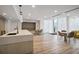 Bright common room with tables, chairs, hardwood floors, and modern design at 3324 Peachtree Ne Rd # 814, Atlanta, GA 30326