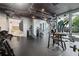 Modern gym featuring weight machines, free weights, and mirrored walls at 3324 Peachtree Ne Rd # 814, Atlanta, GA 30326
