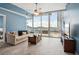 Bright living room featuring floor-to-ceiling windows and access to the outdoor terrace at 3324 Peachtree Ne Rd # 814, Atlanta, GA 30326
