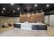 Modern lobby with a reception desk and a unique chandelier with comfortable seating and tiled floors at 3324 Peachtree Ne Rd # 814, Atlanta, GA 30326