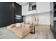 Open-concept lobby with plush seating, a large TV, and modern finishes, creating a welcoming atmosphere at 3324 Peachtree Ne Rd # 814, Atlanta, GA 30326