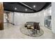A stylish lobby area with a curved sofa, chic chair, and abstract art, bathed in soft, natural light at 3324 Peachtree Ne Rd # 814, Atlanta, GA 30326