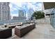 Outdoor lounge with contemporary modular seating and a hammock featuring city views in the background at 3324 Peachtree Ne Rd # 814, Atlanta, GA 30326