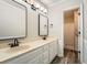Elegant bathroom featuring double sinks with modern faucets and a separate shower at 4953 Apple Valley Rd, Douglasville, GA 30135
